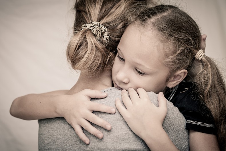 sad daughter hugging his mother